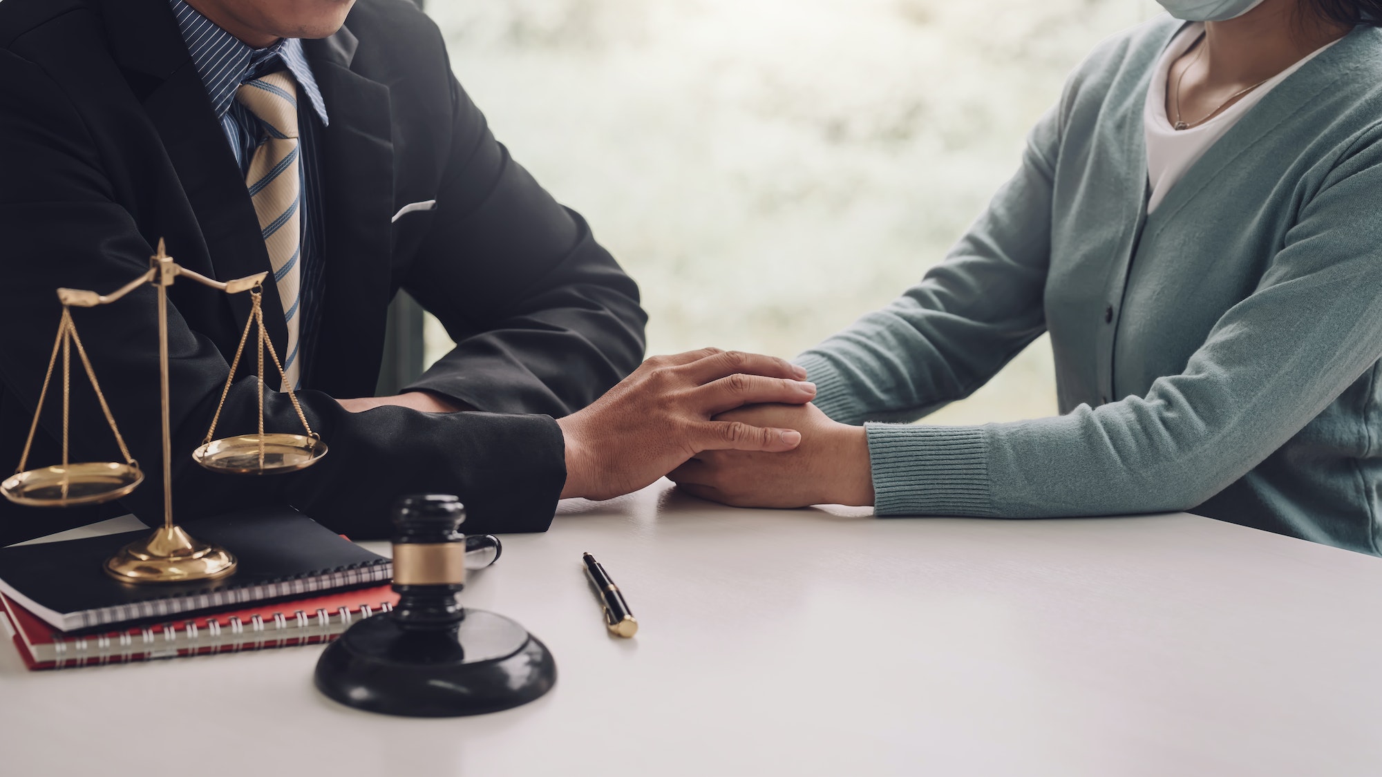 Businessman man lawyer entrusts trust work to customer shaking hands at office.
