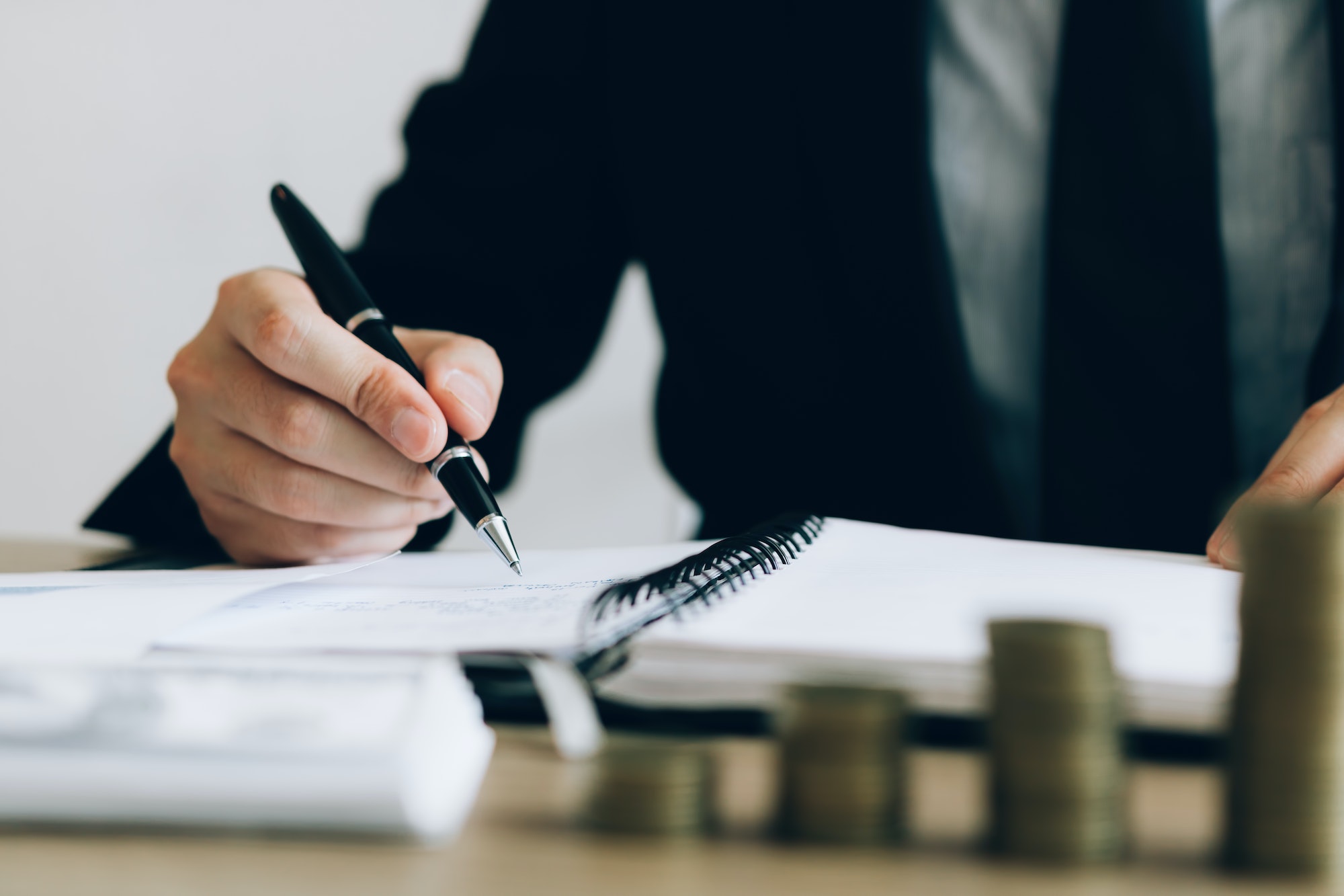 Investors are writing investment records and growth of mutual funds on the table at the office.