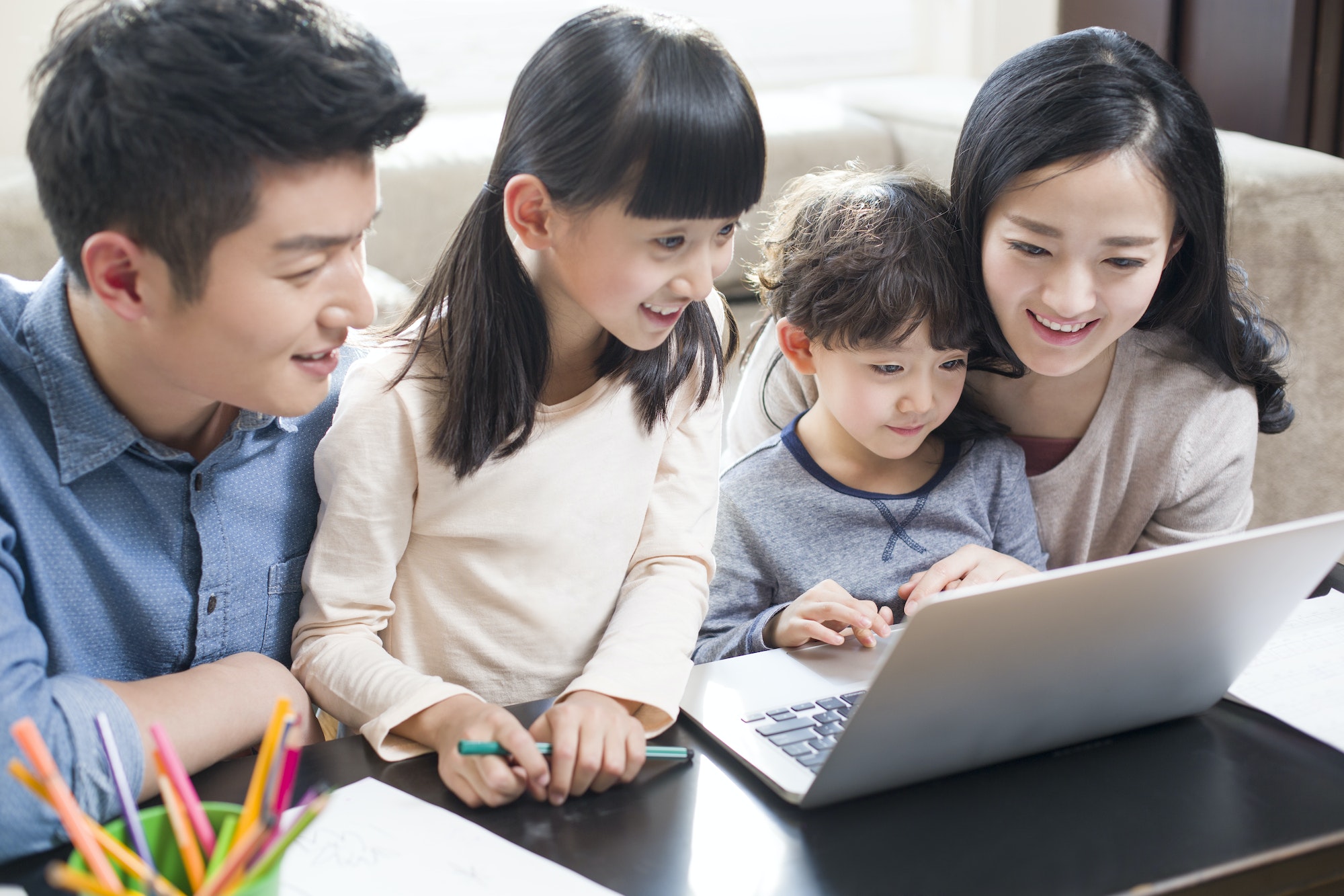 Young family using laptop
