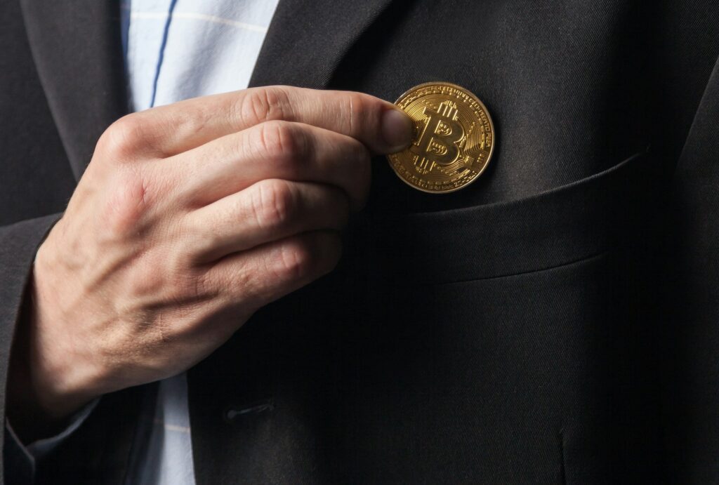 Man puts bitcoin in pocket